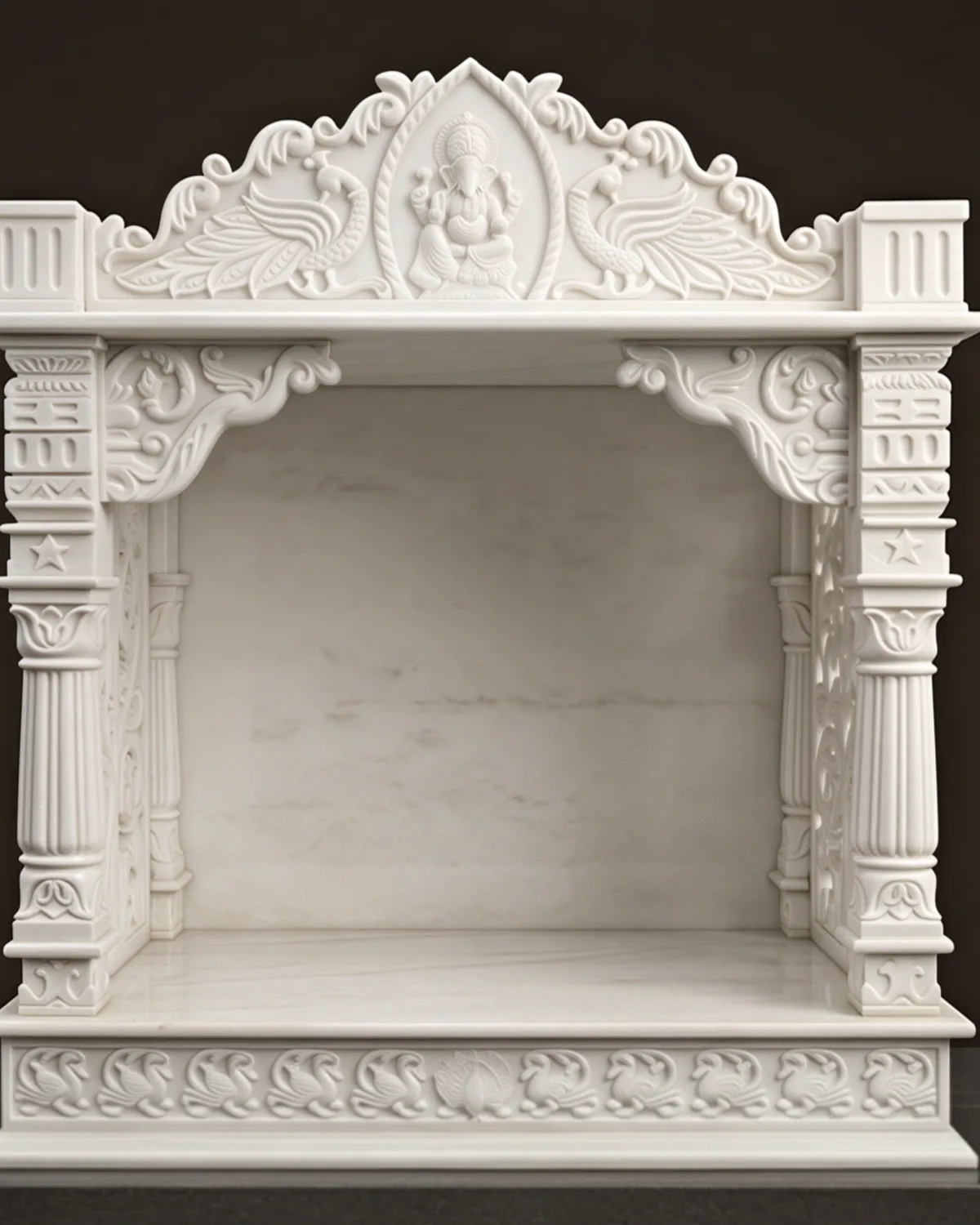 Hand-carved white marble mandir with a Ganesh crest, carved in Makrana for clients in Jaipur