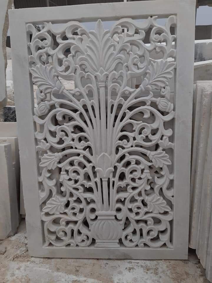 Detail of a hand-carved floral relief in white Makrana marble