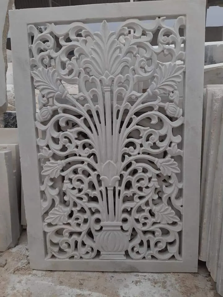 Deep hand-carved floral relief cut into white Makrana marble in the Sasdas Marble workshop at Makrana, Rajasthan