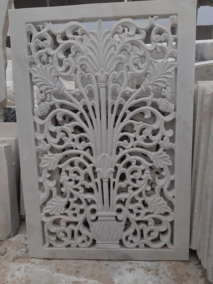 Detail of a hand-carved floral relief in white Makrana marble