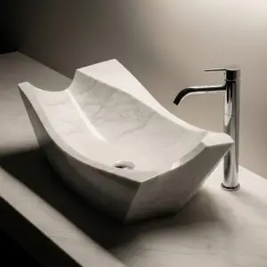 Hand-carved white marble sink installed on a floating wood vanity in a modern bathroom.